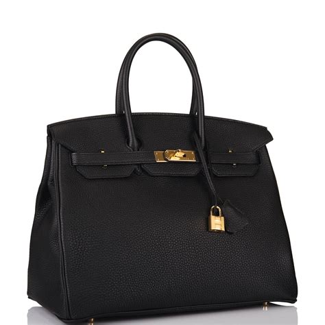 hermes bag black gold|black Hermes bag with scarf.